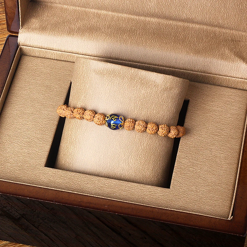 Layered Rudraksha bracelet featuring lapis lazuli blue bead as a gift