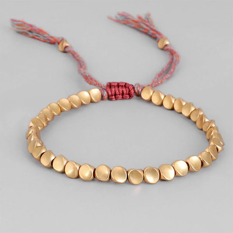 Handmade Tibetan Buddhist bracelet featuring braided copper beads, designed to attract luck and love