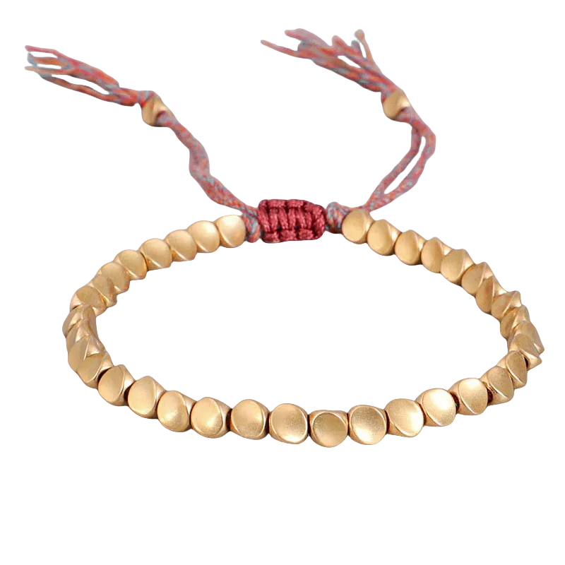 Handmade Tibetan Buddhist bracelet featuring braided copper beads