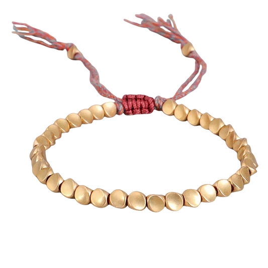 Handmade Tibetan Buddhist bracelet featuring braided copper beads