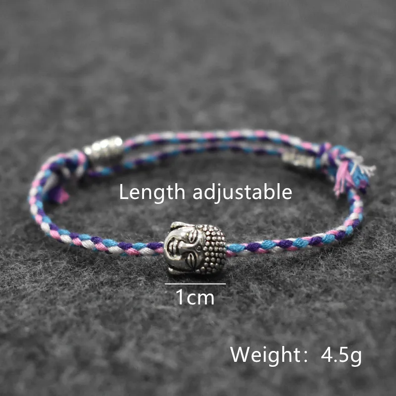 Textured, braided bracelet in vibrant hues featuring a Buddha head centerpiece