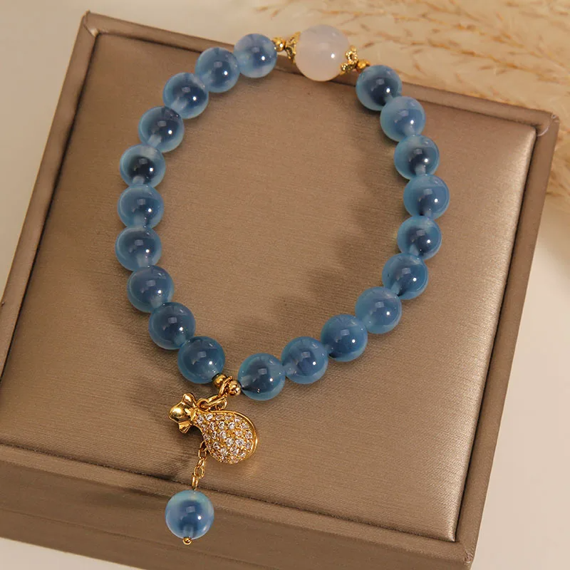 white quartz beads on blue agate crystal bangles on a beautiful case