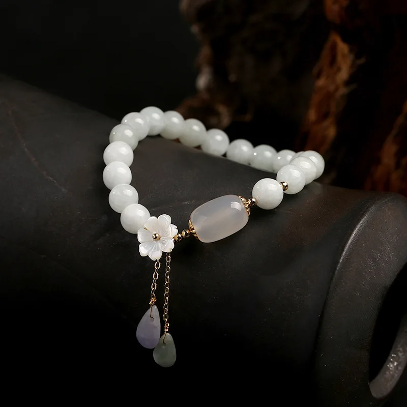 White Jade Bracelet with Agate barrel, shell flowers, and dangling stone charms