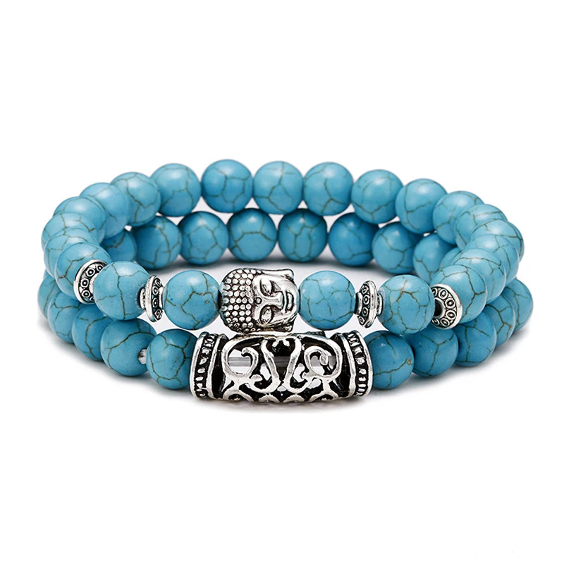 A vibrant blue howlite bead bracelet with a silver Buddha charm and decorative zinc alloy accents, showcasing its striking color