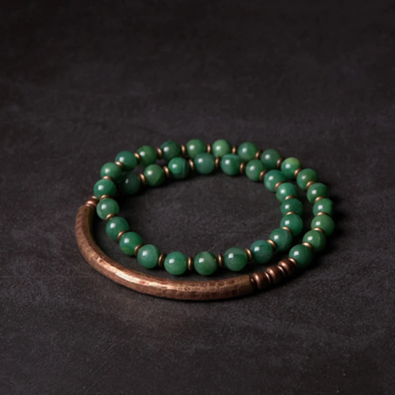 Soothing green African Grass Jade beads on a handcrafted copper bracelet for mental clarity