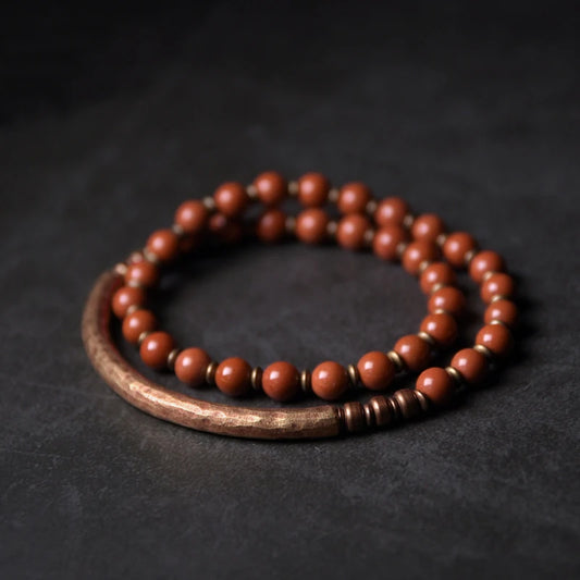 Intricately designed red jasper bead bracelet featuring natural gemstone beads for wisdom and vitality