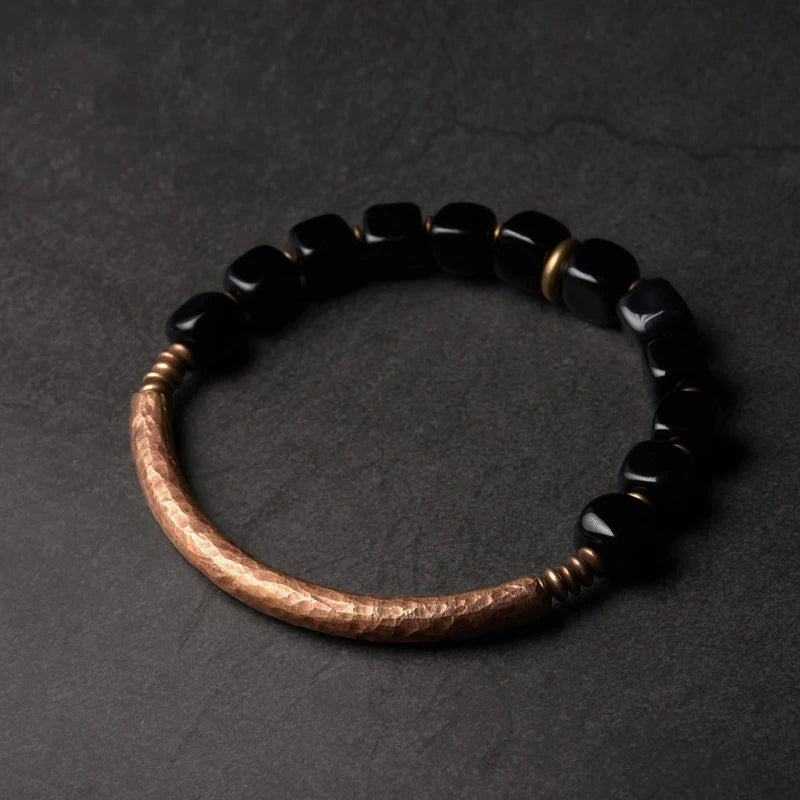 Stylish black obsidian and copper bracelet, designed for protection and bringing wealth