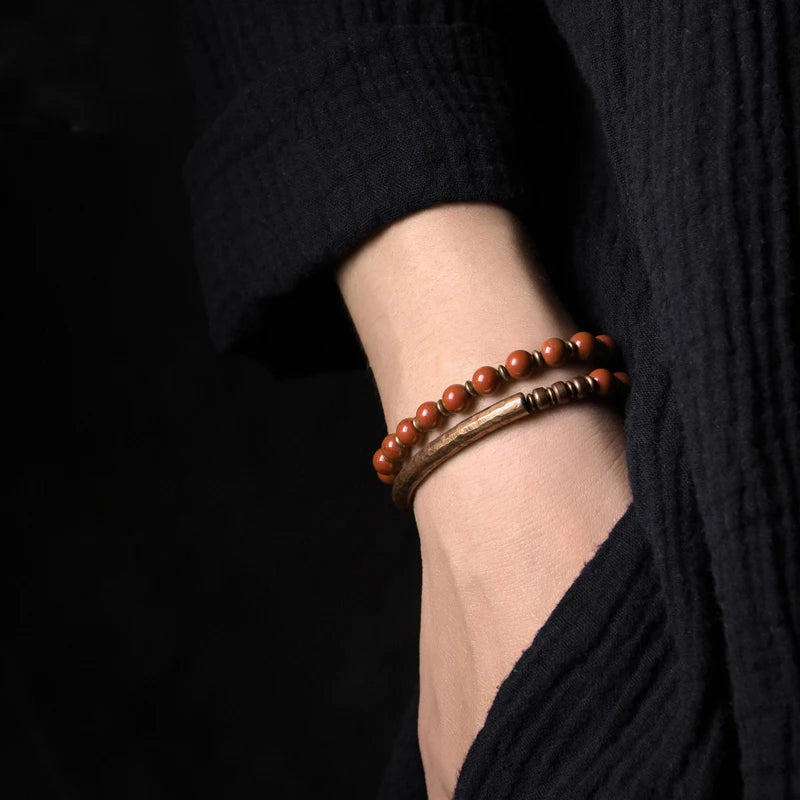 Handmade copper bracelet adorned with Red Jasper beads to boost courage and enhance vitality