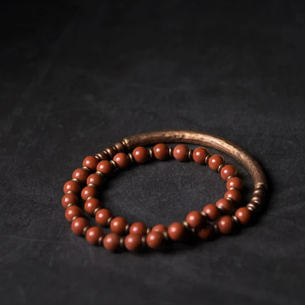 Vibrant Red Jasper beads on a handcrafted copper bracelet for grounding and energy