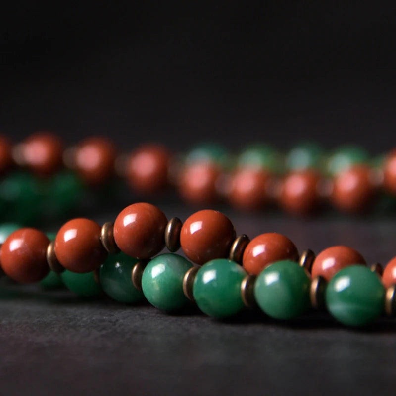 Minimalist copper cuff with green African Grass Jade and reddish-brown Red Jasper stones