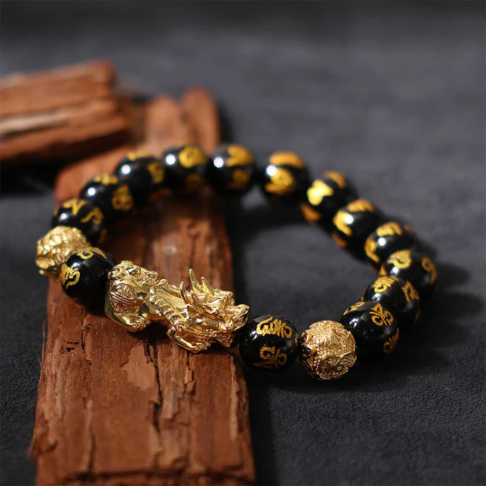 the correct way to place a Pixiu bracelet with the creature's head facing outward to attract wealth.