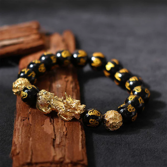 the correct way to place a Pixiu bracelet with the creature's head facing outward to attract wealth.