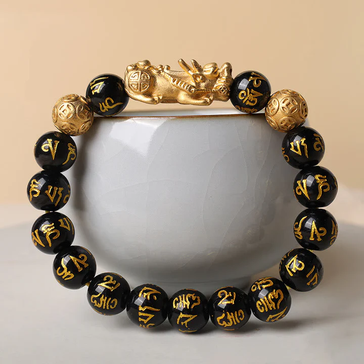 Showing the durable elastic cord and stretchable design of a genuine black obsidian gemstone bracelet
