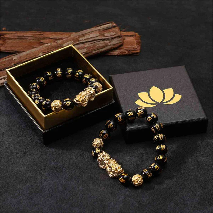 A wealth luck bracelet safely placed inside a luxury red and gold Feng Shui gift box
