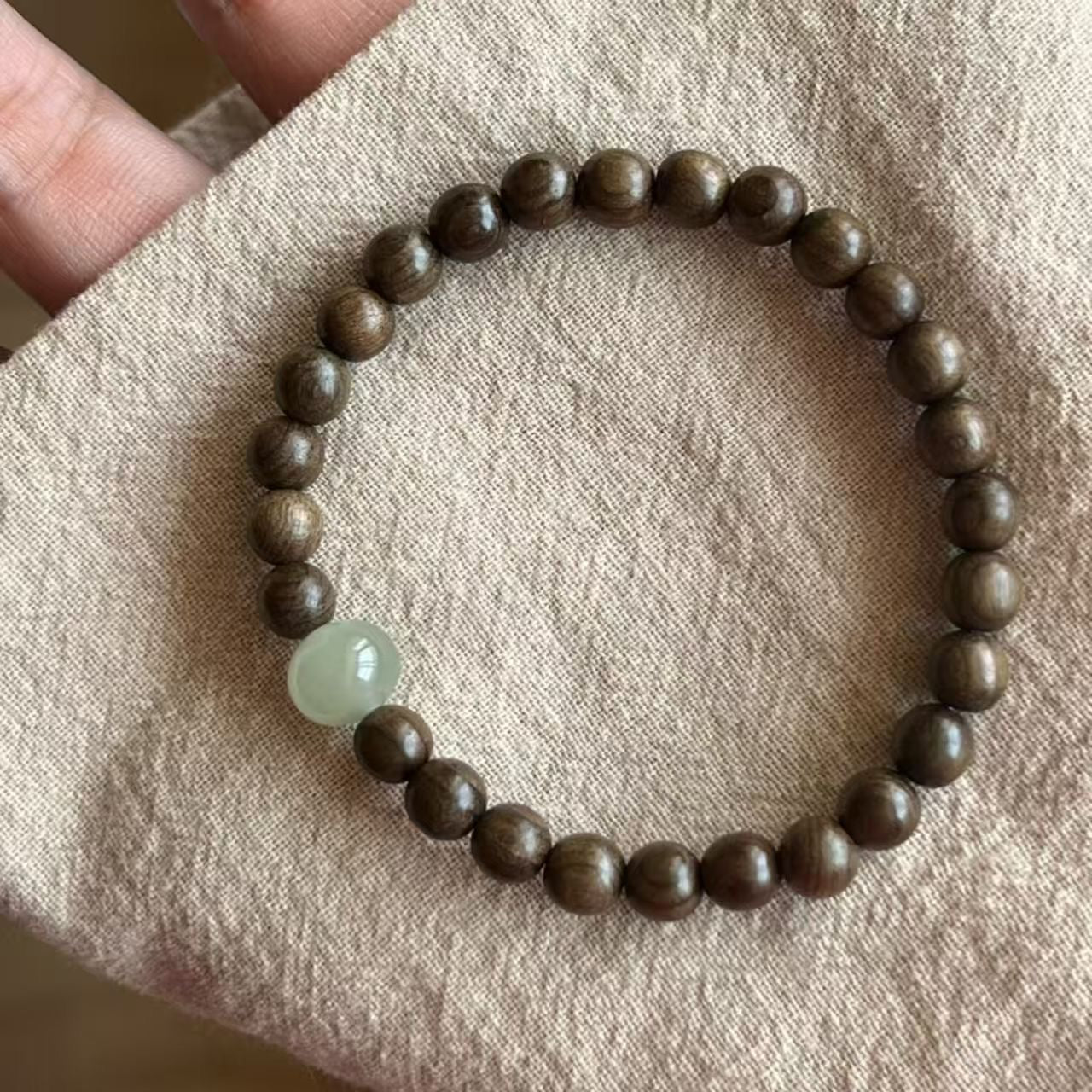 Flat lay of sandalwood stack bracelet set