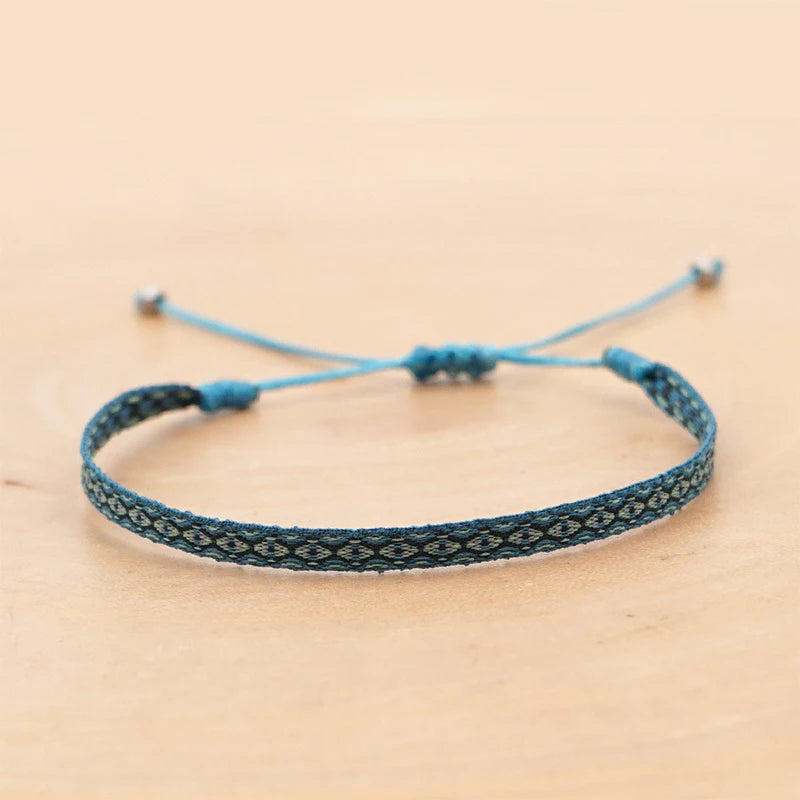 Seville flat woven boho bracelet — handcrafted cotton band with low-profile loom weave, ideal for layering in adjustable stack sets